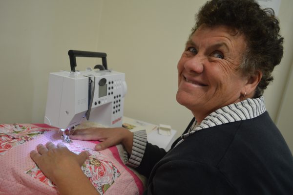 Dearne Callaghan sewing quilts for Parkes Hospital.